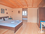 [Translate to Italiano:] Surf Villa Fuerteventura, Bungalow Schlafzimmer im Holzdesign